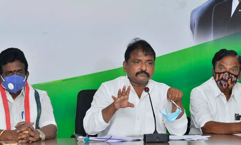 APCC president Dr Sake Sailajanadh, PCC general secretary Rajiv Ratan and others addressing a press conference at Andhra Ratna Bhavan in Vijayawada on Tuesday