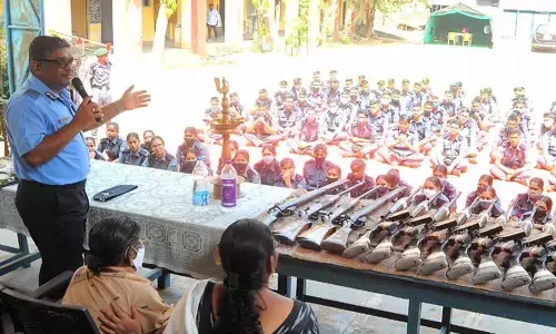 Group Captain Pankaj Gupta, Commanding Officer, addressing NCC cadets in Vijayawada on Tuesday