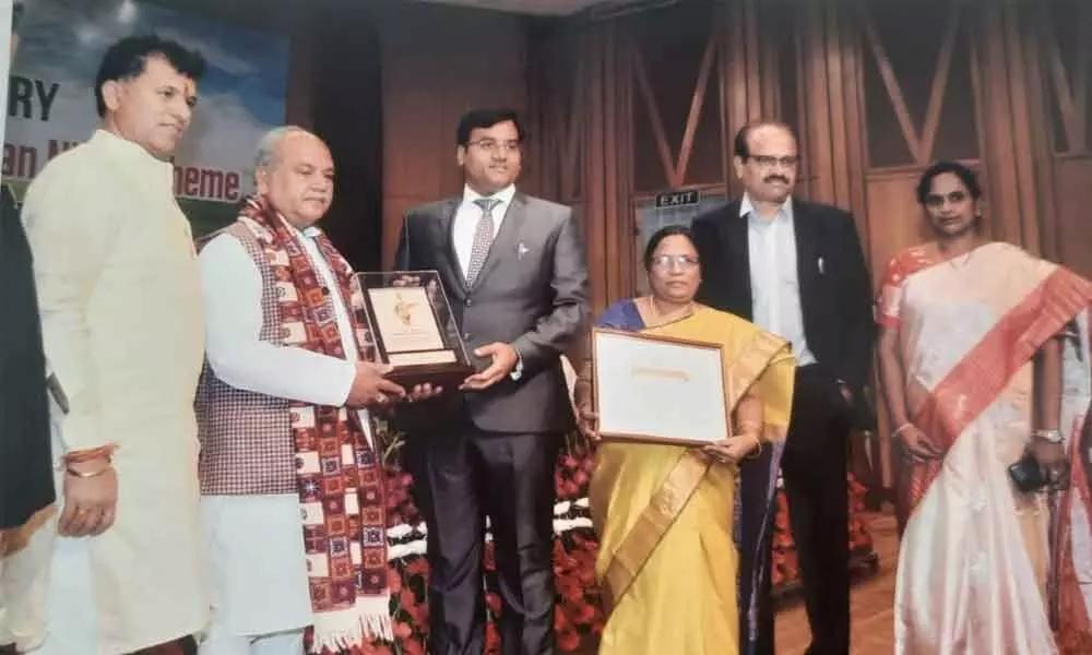 Nellore Collector K V N Chakradhar Babu receiving award from Union Agriculture Minister NS Tomar at a programme in New Delhi