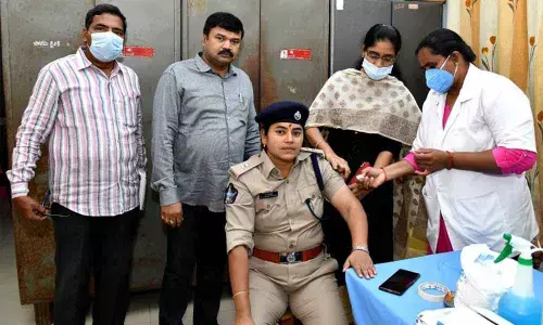 OSD K Chowdeswari receiving the COVID vaccine at Police clinic in DPO Ongole on Wednesday