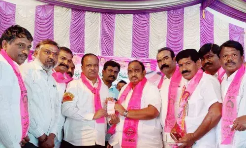 State Police Housing Corporation Chairman Koleti Damodar and MLA Vodithala Satish Kumar at a meeting at Shubham Garden function hall