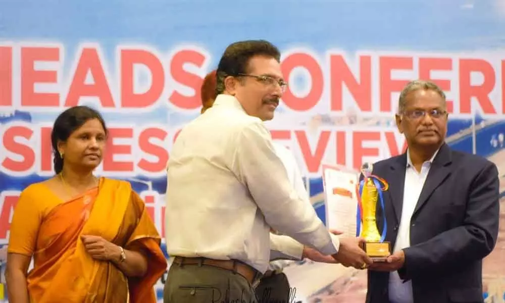 Chief Postal Master General M Venkateswarlul presenting award to KVLN Murthy