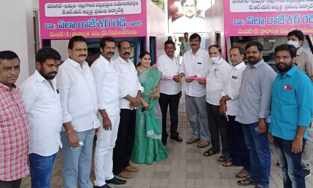 TRS leaders T Madhu and G Krishna flagging off Graduate MLC campaign vehicles at the party office in Khammam on Thursday. SUDA Chairman Bachu Vijay Kumar also seen