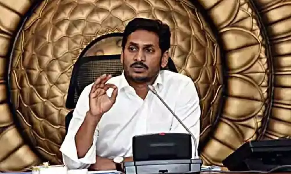 Chief Minister Y S Jagan Mohan Reddy reviewing implementation of livelihood schemes and criteria for felicitation of volunteers at his camp office in Tadepalli on Friday