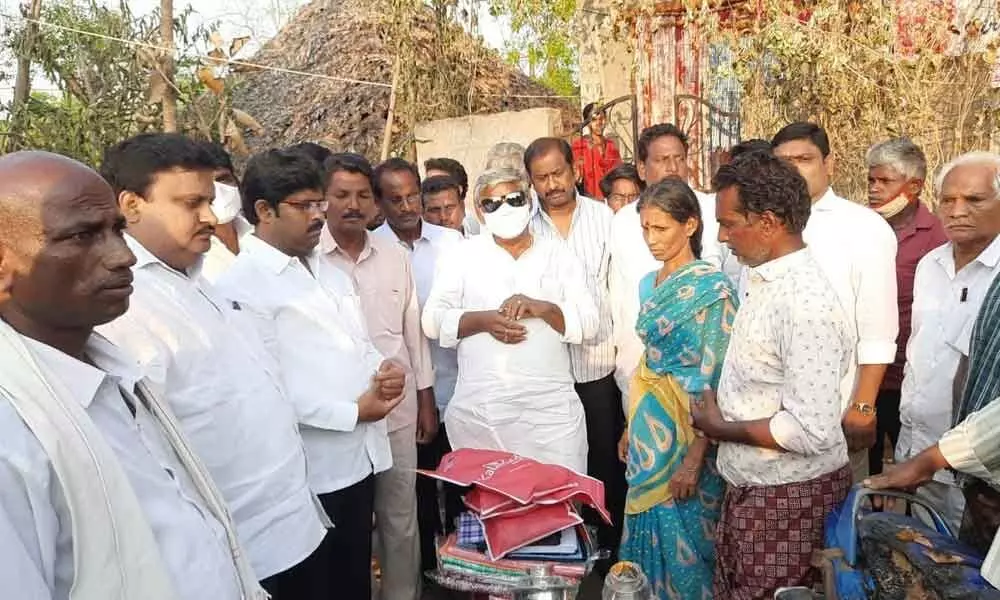 TDP State Vice-President Jyothula Nehru consoling fire victims at Gopalapuram village on Friday