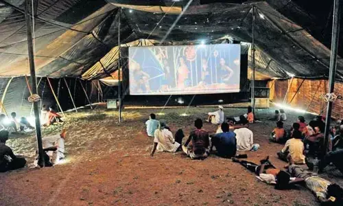 Watching movie in touring talkies