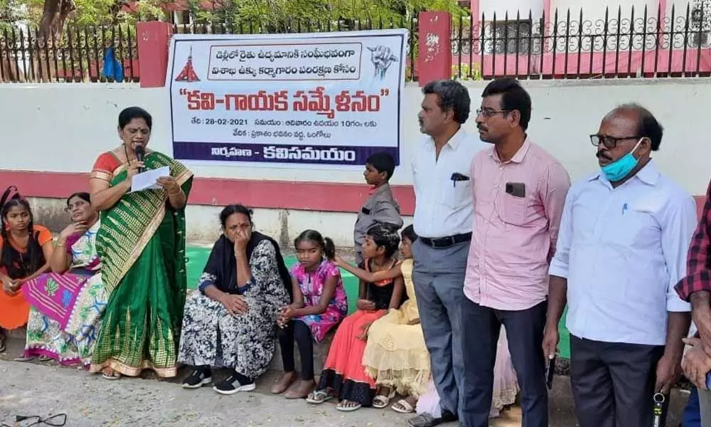 Poets and children participating in the programme