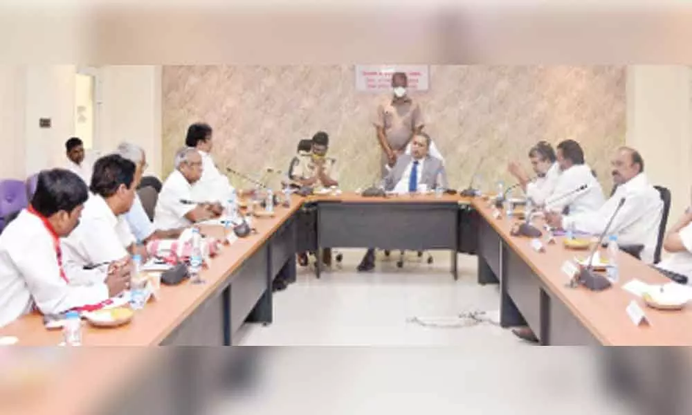 State Election Commissioner N Ramesh Kumar holds a meeting with leaders of various political parties on municipal polls at his chamber in Vijayawada on Monday