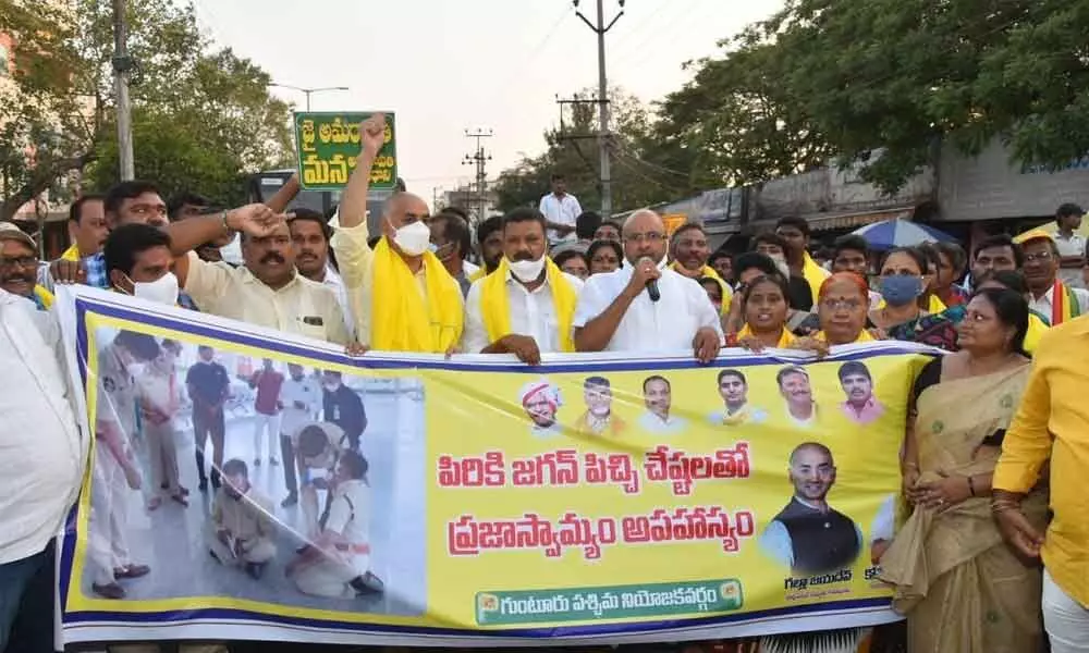 TDP leaders staging a protest at Amaravati Road in Guntur on Monday, against detention of TDP national president N Chandrababu Naidu at Renigunta Airport