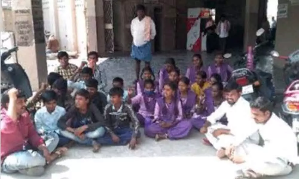 DYFI members along with the students staging a protest in front of Adoni bus depot manager’s office on Wednesday