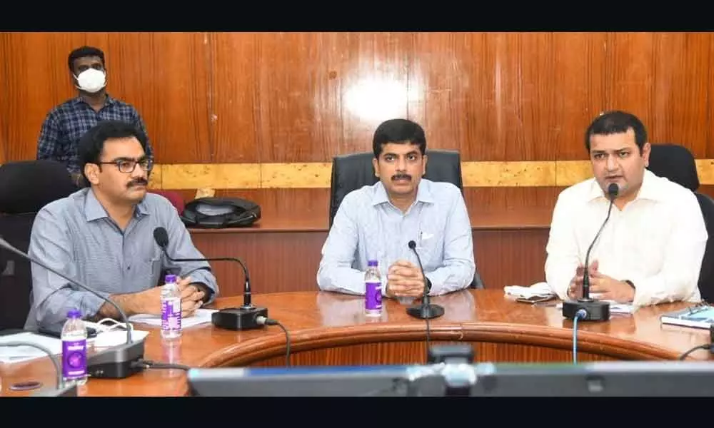 Civil Supplies Commissioner Kona Sasidhar (middle) speaking at a review meeting in Visakhapatnam