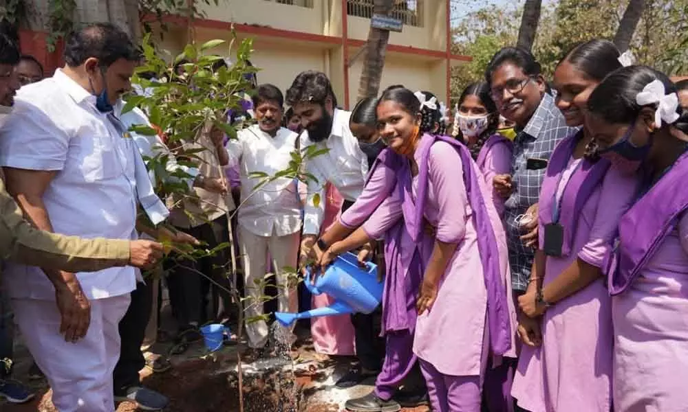 MP Margani Bharat planting saplings at Municipal High School in Rajamahendravaram on Wednesday as part of Green Challenge