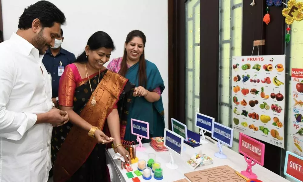 Chief Minister looks at the teaching aids being supplied to YSR Pre-Primary Schools during a review on Anganwadis at his camp office on Thursday
