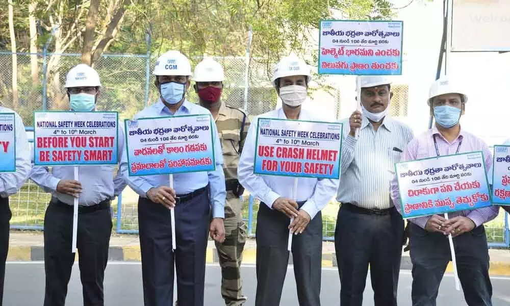 CGM (Ramagundam & Telangana) Sunil Kumar and NTPC senior officials displaying safety slogan placards at the main plant’s first gate at NTPC Ramagundam on Thursday