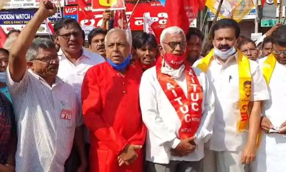 TDP, CPM, IFTU leaders staging protest in front of Gandhi statue centre in Nellore on Friday