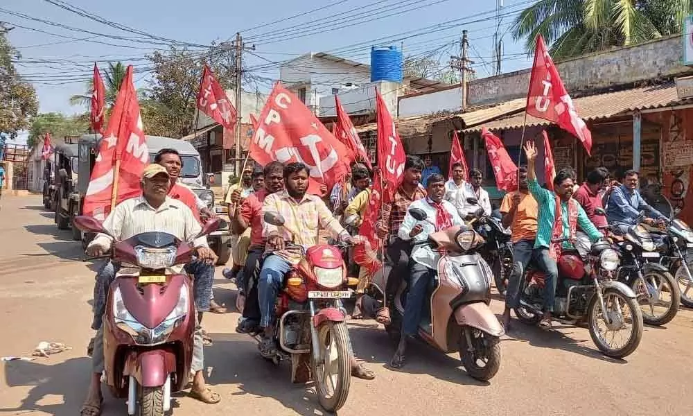 CPI leaders taking a bike rally against privatisation of Visakha Steel Plant, in Kurnool on Friday