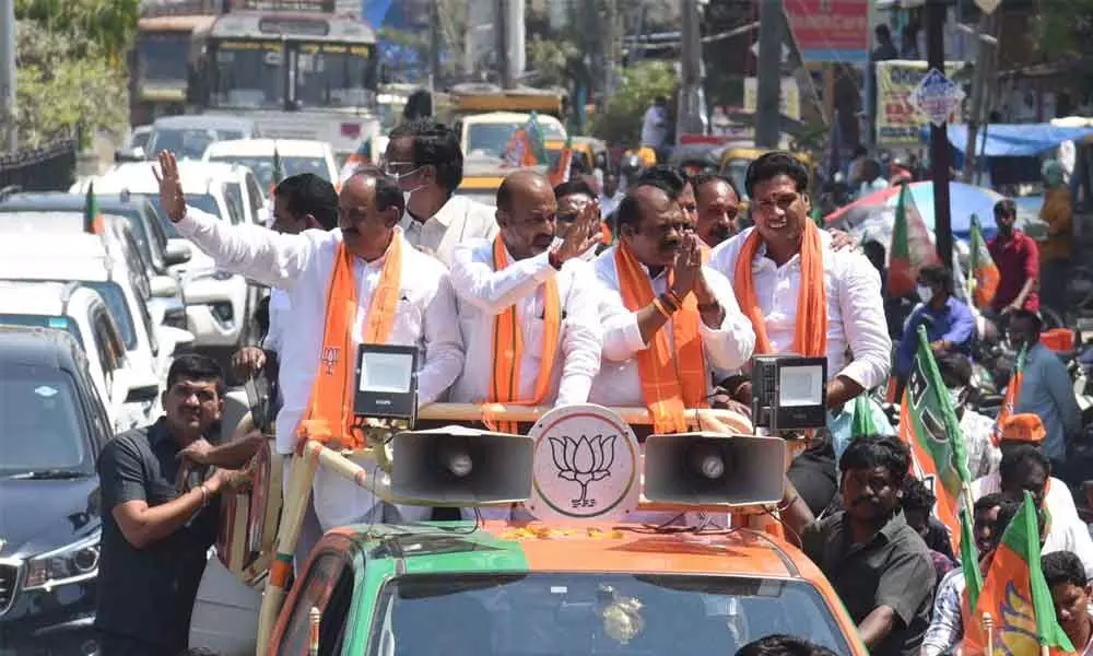BJP cadres led by their State president Bandi Sanjay taking out a rally in Narsampet on Friday