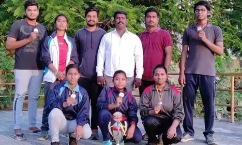 Junior team members with their medals won at State level fencing tournament