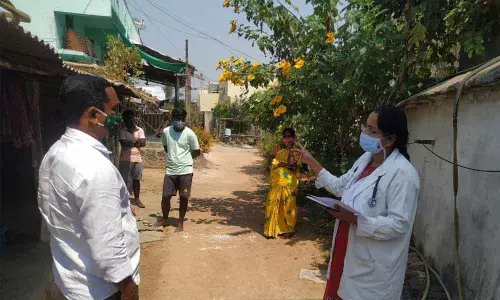 Medical staff enquiring about the contacts of corona infected persons, in Muthyampet village on Friday