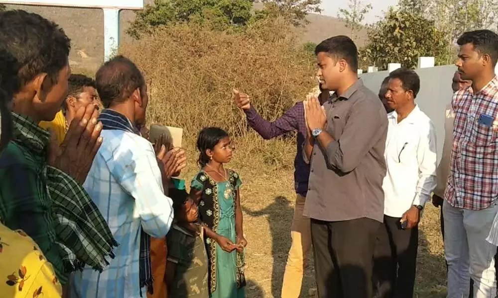 Chintapalli ASP Vidhya Sagar Naidu interacting with the family members of the ex-militia member Korra Pilku,   who was allegedly killed by the Maoists