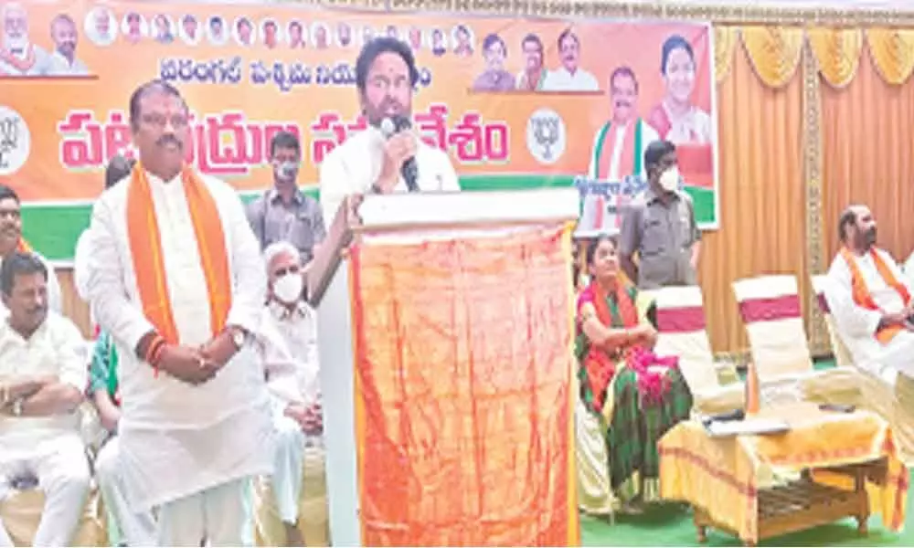 Minister of State for Home Affairs G Kishan Reddy addressing a meeting in Warangal on Saturday. BJP candidate Gujjula Premender Reddy is seen standing next to him