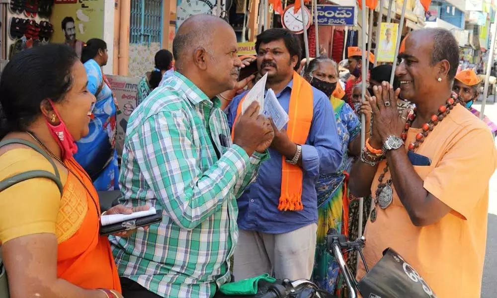 BJP candidate Akkipalli Munikrishna Yadav campaigning at 26th ward in Bandla Street in Tirupati on Saturday
