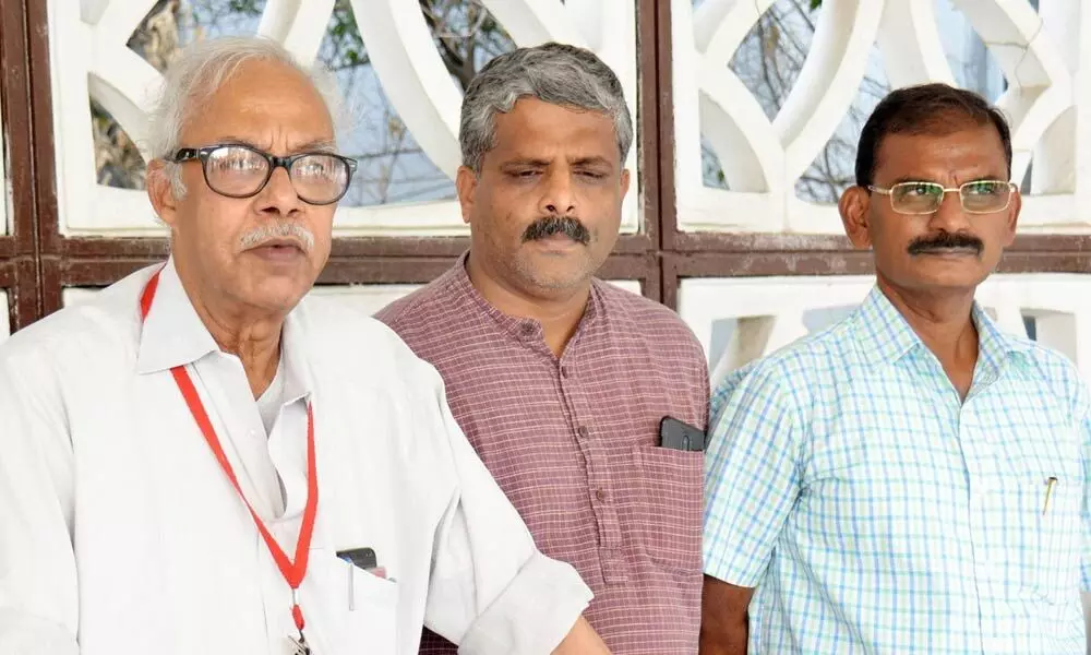 Central trade union leaders addressing a press conference at Andhra Bhavan in New Delhi on Monday