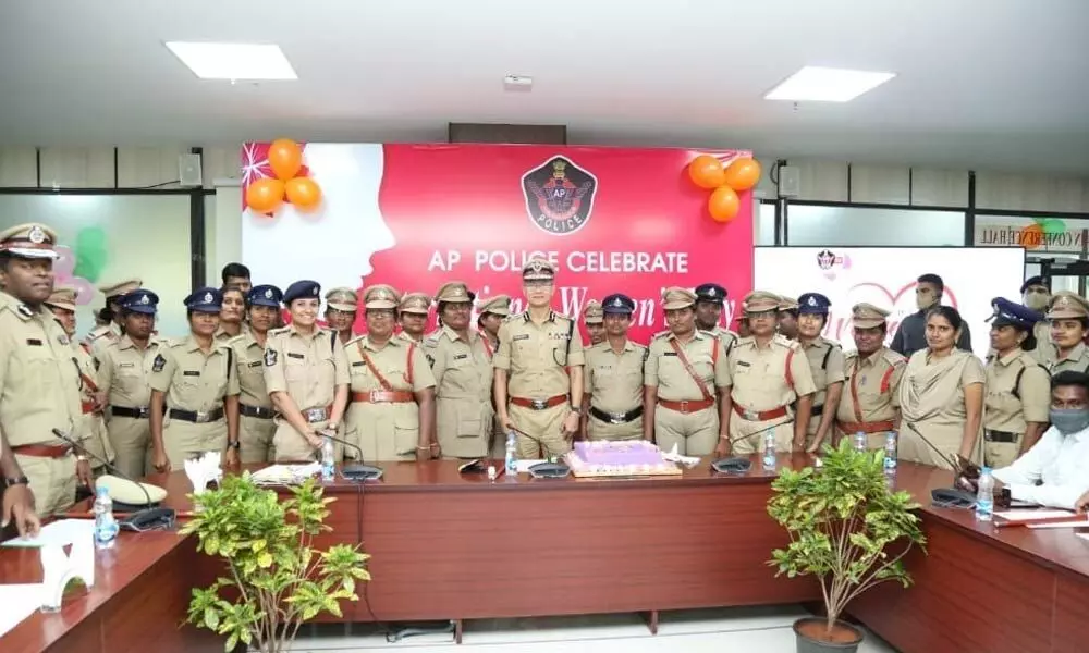 DGP D Gautam Sawang with women police officials who were given awards on the occasion of International Women’s Day at DGP office in Mangalagiri on Monday