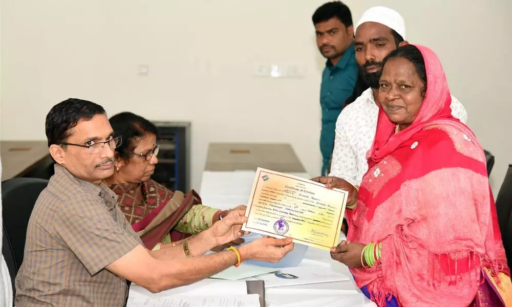 Legislature Returing Officer handing over Election Declaration Form to Mohammed Karimunneesa of Vijayawada on Monday