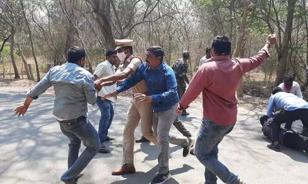 Police trying to stop clash between the protesting students and TRSV workers at Kakatiya University in Hanamkonda on Monday