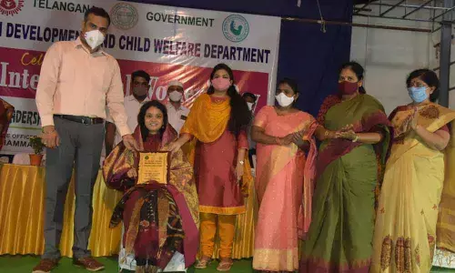 District Collector RV Karnan felicitating ZP Chief Executive Officer CH Priyanka on International Womens Day in Khammam on Monday