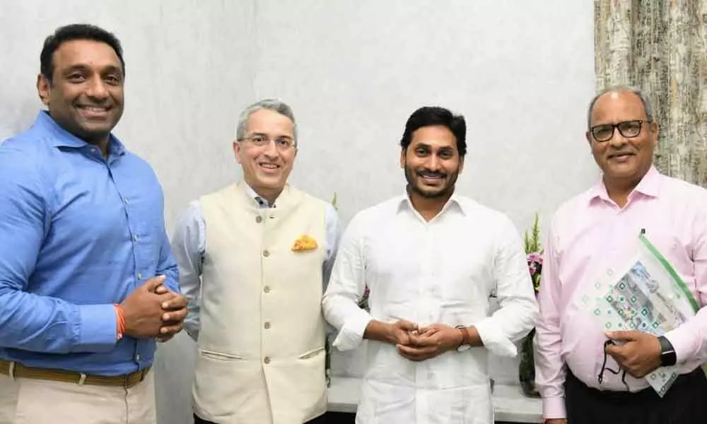 Dixon Technologies India Ltd chairman Sunil Vachani, CEO Pankaj Sharma and Industries Minister Mekapati Goutham Reddy with Chief Minister  Y S Jagan Mohan Reddy at his camp office in Tadepalli on Tuesday