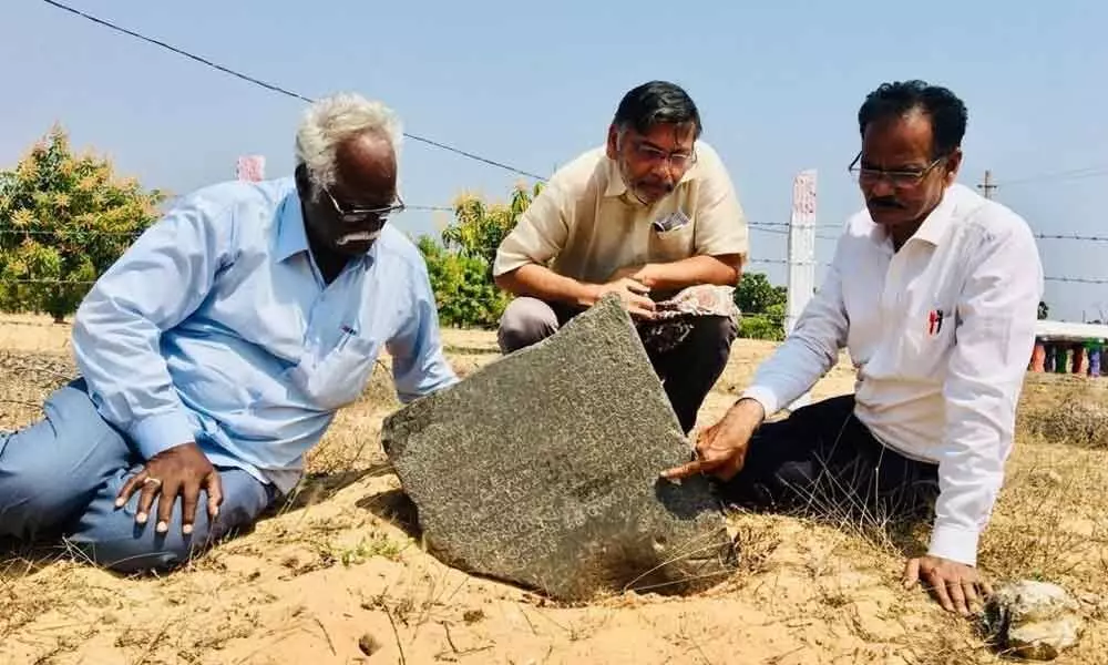 Dr Emani Sivanagireddy, Dr Jyothi Chandramouli and Ronda Dasaratha Ramireddy deciphering the inscription found in Motupalli