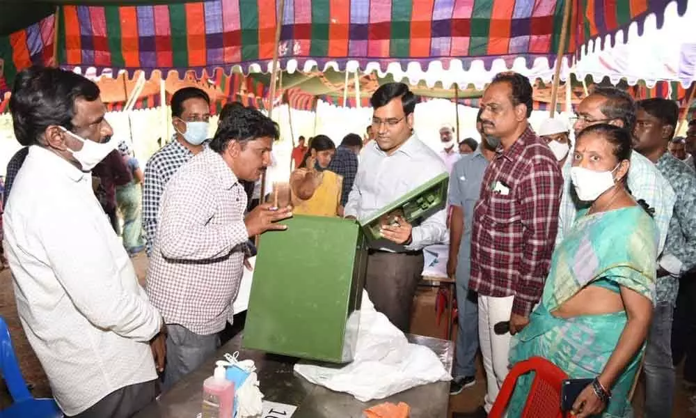 Nellore District Collector KVN Chakradhar Babu verifying the polling material at a distribution centre in Venkatagiri on Tuesday