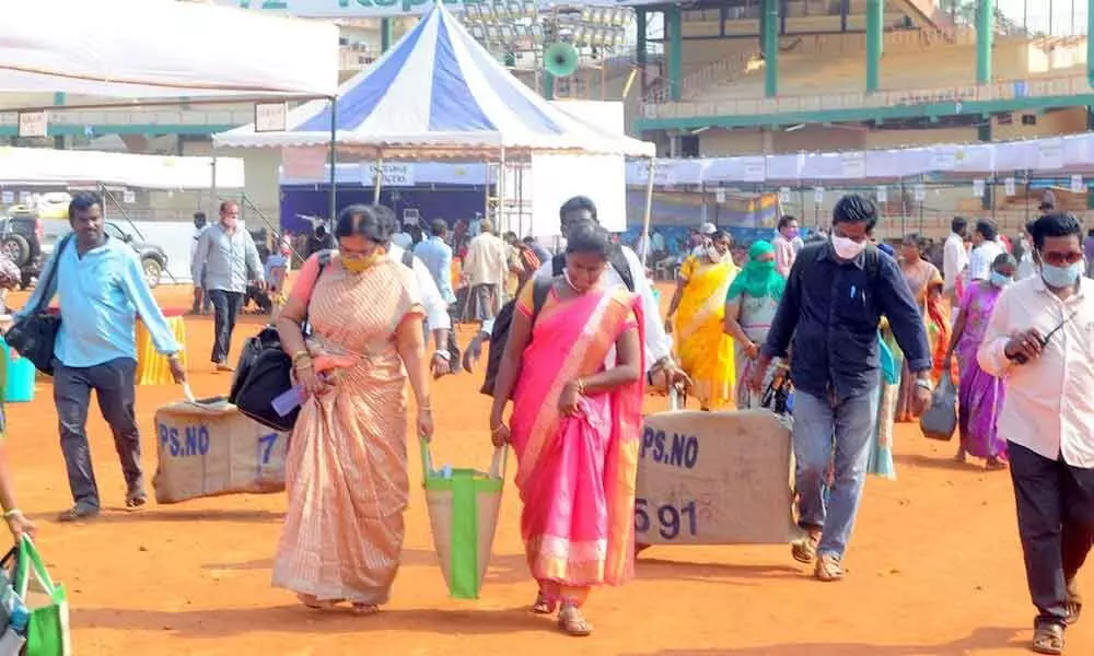 Election officials collecting polling material at IGMC stadium on Tuesday in Vijayawada for Wednesday’s municipal elections