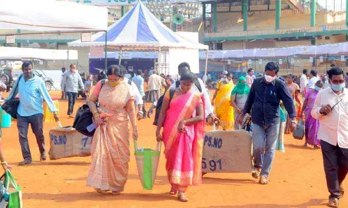 Election officials collecting polling material at IGMC stadium on Tuesday in Vijayawada for Wednesday’s municipal elections