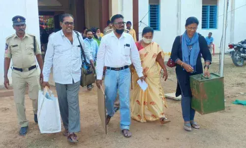 Poll staff leaving with material