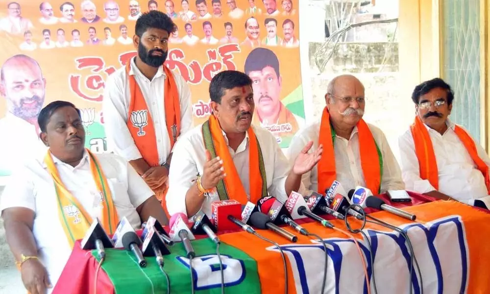 BJP district president Galla Satyanarayana speaking to the media at party office in Khammam on Wednesday