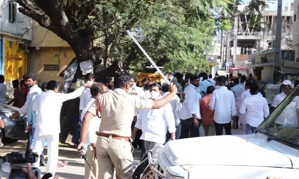Police resort to lathi-charge at 15th ward in front of Mahatma Gandhi polling station to avoid conflict between the YSRCP and TDP followers, in Tirupati on Wednesday