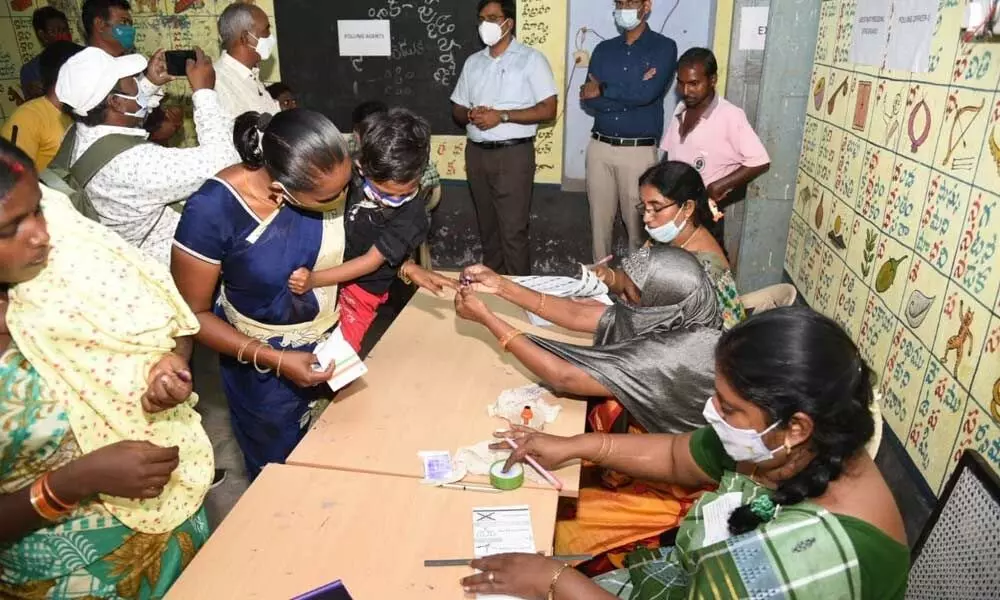 Collector K V N Chakradhar Babu observing polling process at a polling booth in Atmakur on Wednesday
