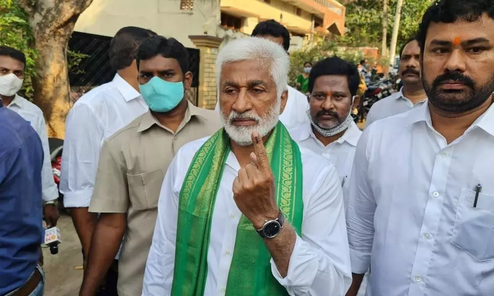 YSRCP Rajya Sabha MP V Vijayasai Reddy showing his index finger after casting his vote at the 14th ward in Visakhapatnam on Wednesday