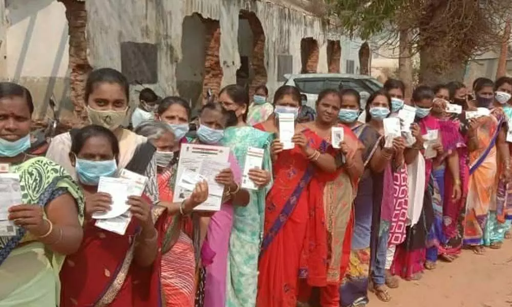 Women voters waiting patiently to cast their votes at a polling station in Palakonda Nagara Panchayat