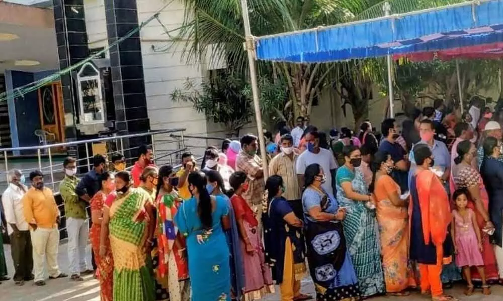 Serpentine queuelines at polling stations in Ongole on Wednesday