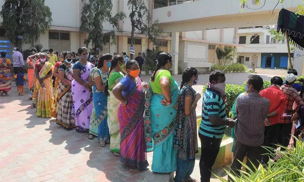 Voters waiting in queue for their turn to cast votes in Vijayawada Wednesday Photo: Ch Venkata Mastan