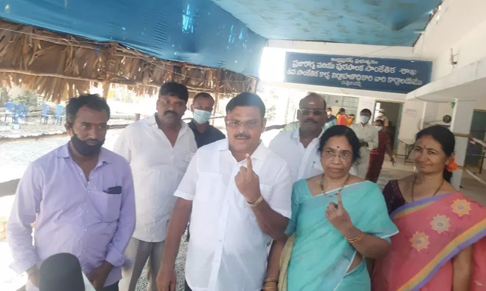 MLA Ambati Rambabu showing his inked finger after casting his vote in Sattenapalli municipal elections on Wednesday