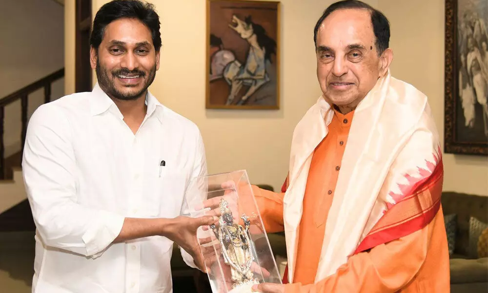 Chief Minister Y S Jagan Mohan Reddy felicitates BJP MP Dr Subramanyam Swamy at his camp office on Wednesday