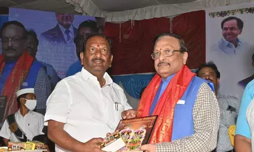 Welfare Minister Koppula Eshwar felicitating noted writer Yandamoori Veerendranath at a personality development programme in Dharmapuri on Wednesday