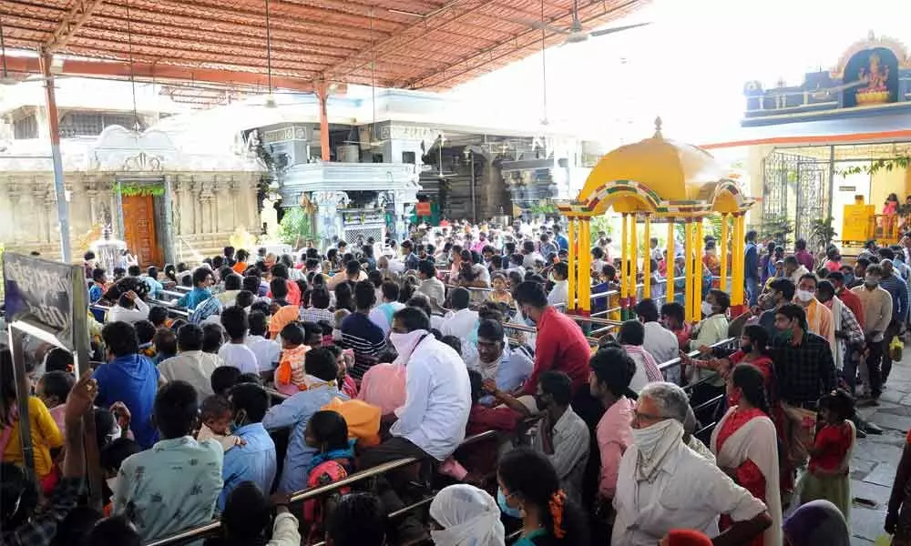 Devotees wait in queues at the Bhadrachalam temple on Thursday