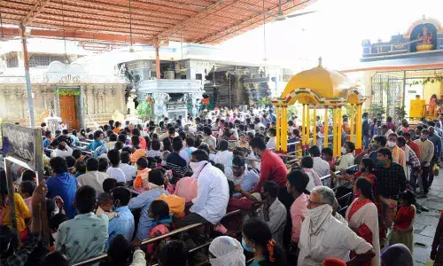 Devotees wait in queues at the Bhadrachalam temple on Thursday