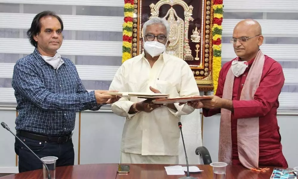 UIC CEO and MD Sanjay K Singh and TTD EO K S Jawahar Reddy exchanging copies of MoU signed for construction of children’s hospital, at Tirumala on Friday. TTD Chairman Y S Subba Reddy is seen.